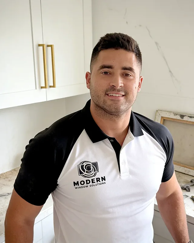 David Gallo, owner of Modern Window Solutions, in a black and white company polo.